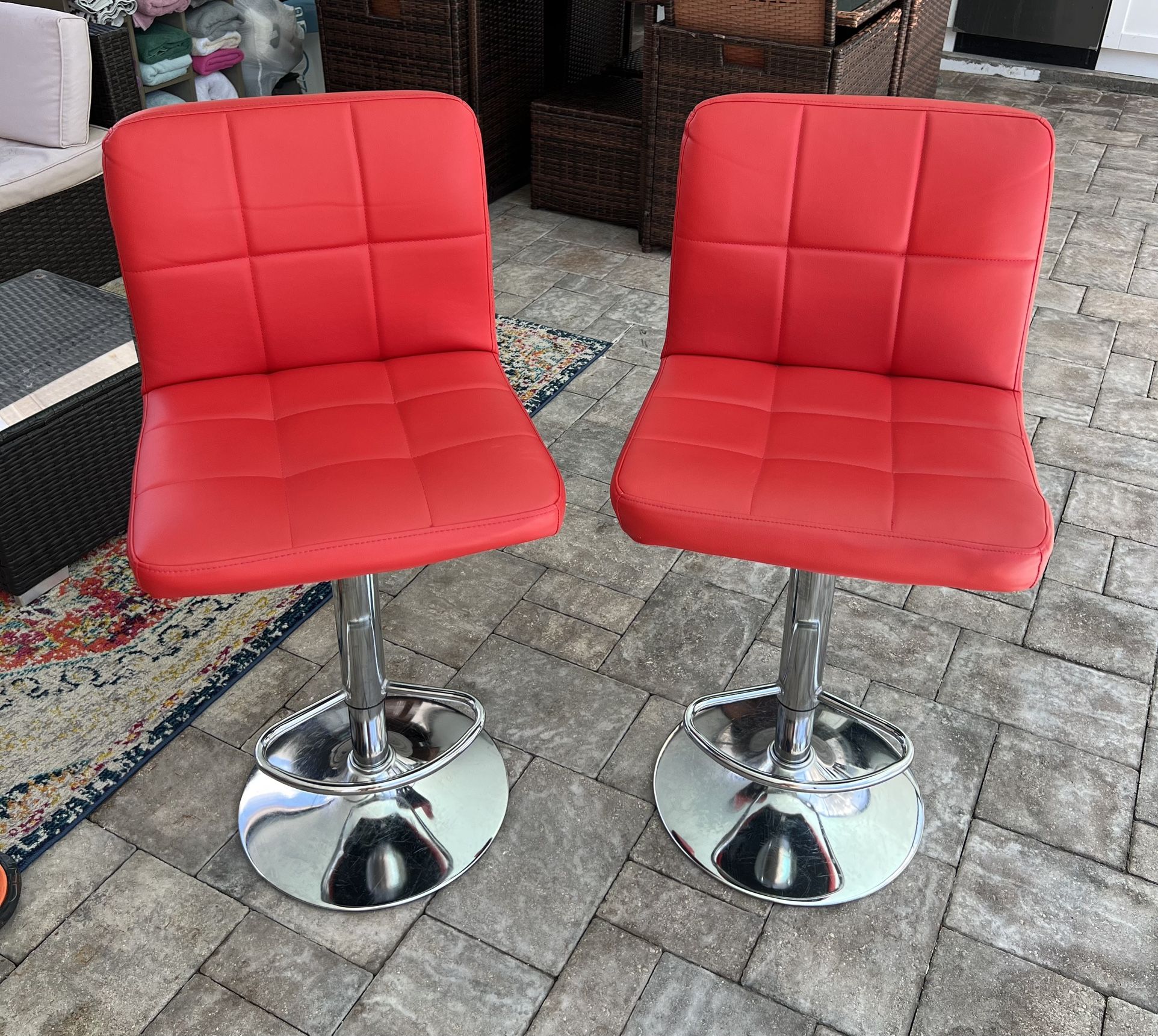 Adjustable Leather Swivel Bar Stools. Gloss Red. Set of 2. I can deliver for an additional cost. In very good condition.