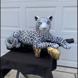 Snow Leopard On The Log Statue