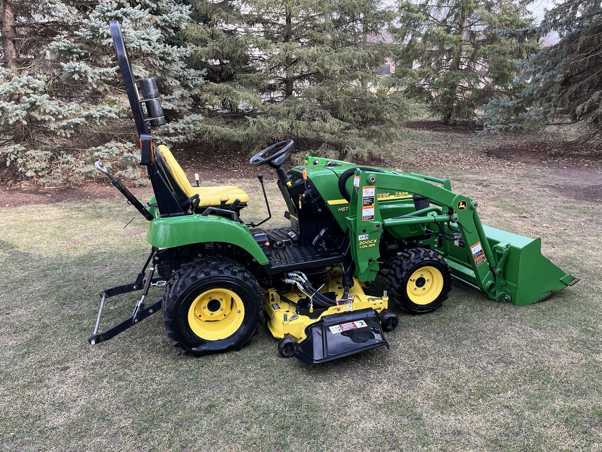 John Deere 2305 Four Wheel Drive Compact Tractor With A Loader And 62 Inch Lawn Mower Deck