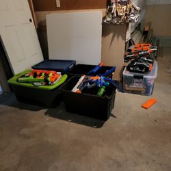 A Bunch Of Nerf Guns And Attachments 