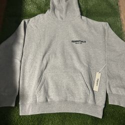 Grey Fear of God Essentials hoodie