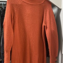 Orange sweater with buttons down the side