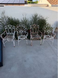 Set of 4 mis-matched wrought iron chair set Vintage amazing!