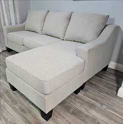 Like new! 10/10, used only for stage performances, Ashley 2-piece sectional sofa, all covers are removable for washing, reversible, smoke and pet free