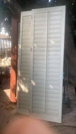3 white folding doors
