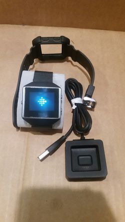 Fitbit blaze classic with charger and sports band.