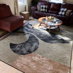 Several area rugs and furniture 