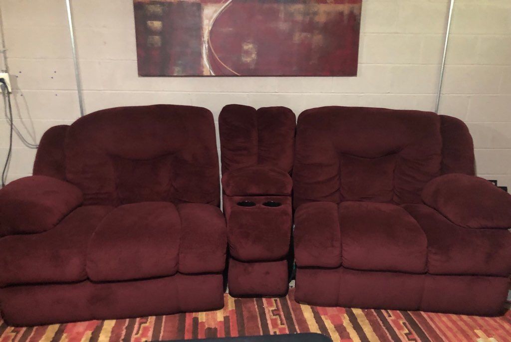 Burgundy oversized love seat and cup holders