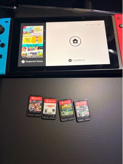 nintendo switch with games and accessories