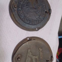 2- Antique JOHN DEERE & MANSUR Co CAST IRON Corn Planter Lid.

 FARM ADVERTISING