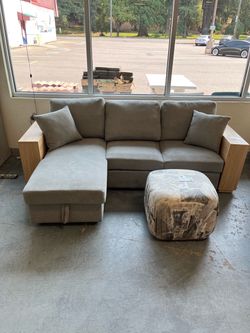 Grey storage couch with shelf and bed (in store)