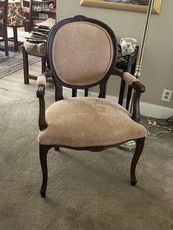 Pair of tan arm chairs