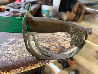 A sword with a brass handle