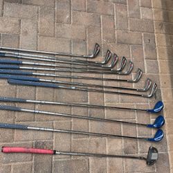 Woman’s Spaulding Golf Set In Right Hand 