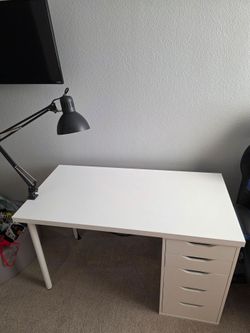 Ikea white desk with 2 grey lamps