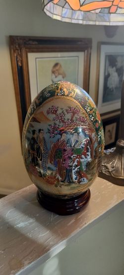 Nice porcelain Chinese egg with a stand.