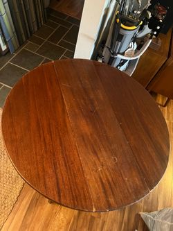 Antique round wood table sides fold down