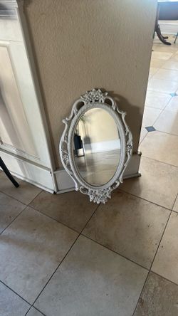 White  framed mirror 27inches tall 16 inches wide $15 located in Ceres