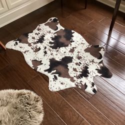 Faux Cowhide Rug with grip back - 44” x 27” clean and washable