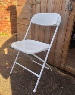 Used white folding chairs s,a,l, e