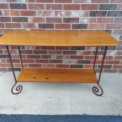 Rustic Style Sofa Table Made of Pine Wood with Metal Scrolled Legs  in a Faux Rust Finish.