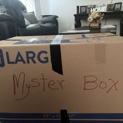 Mystery box for sale with more than 100 items including electronics, phone cases, makeup things and home goods.