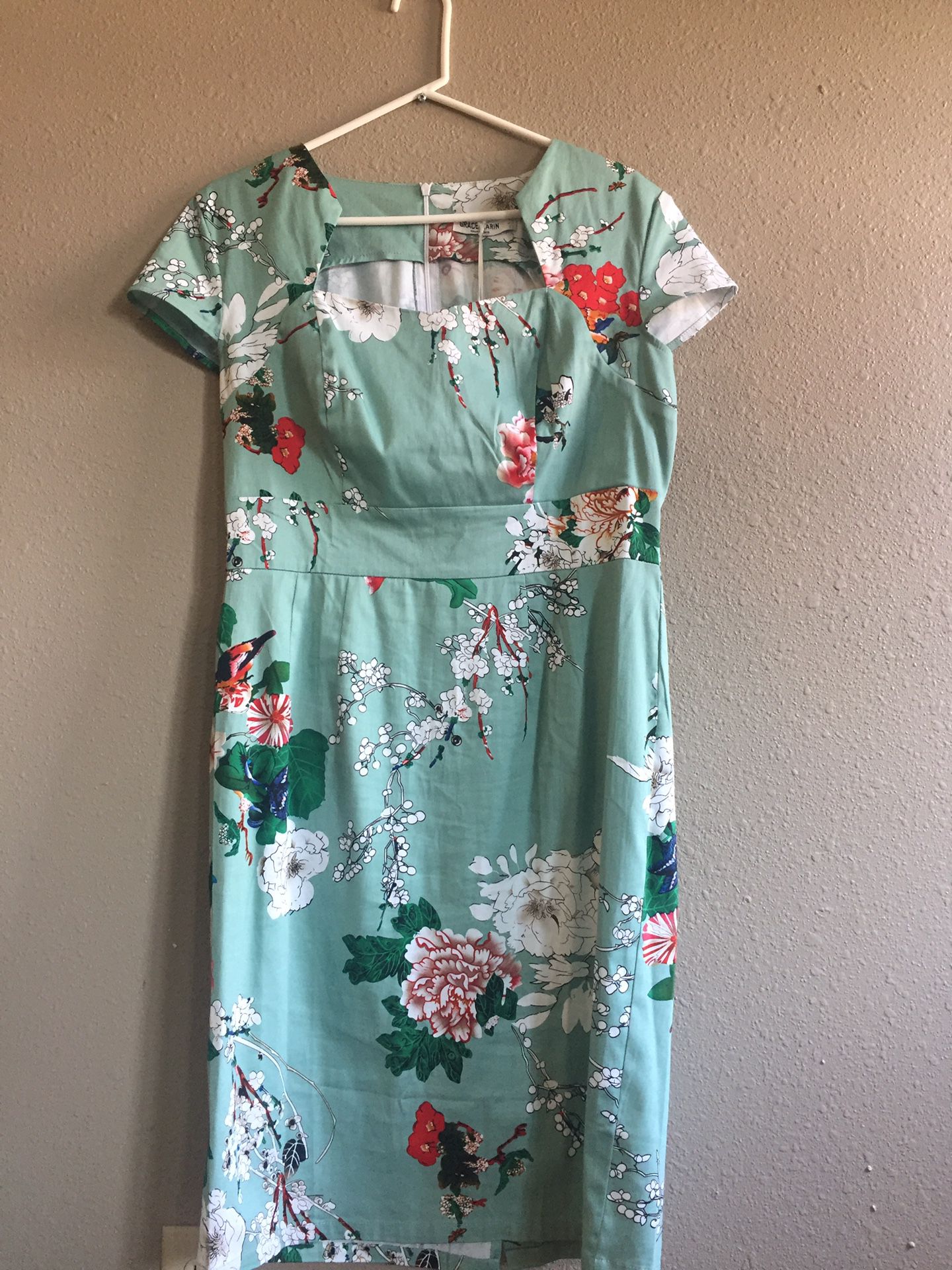 Robins Egg Blue and floral dress. Form fitting. Size 8