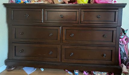 Brown dresser with mirror
