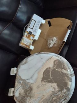 Round new toilet seat.