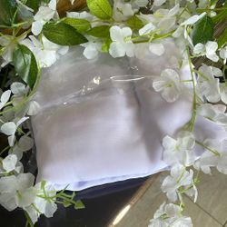 Light lavender arch for Wedding along with white flower vines to go across