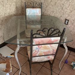Nice Glass Table With Metal Base With Three Chairs