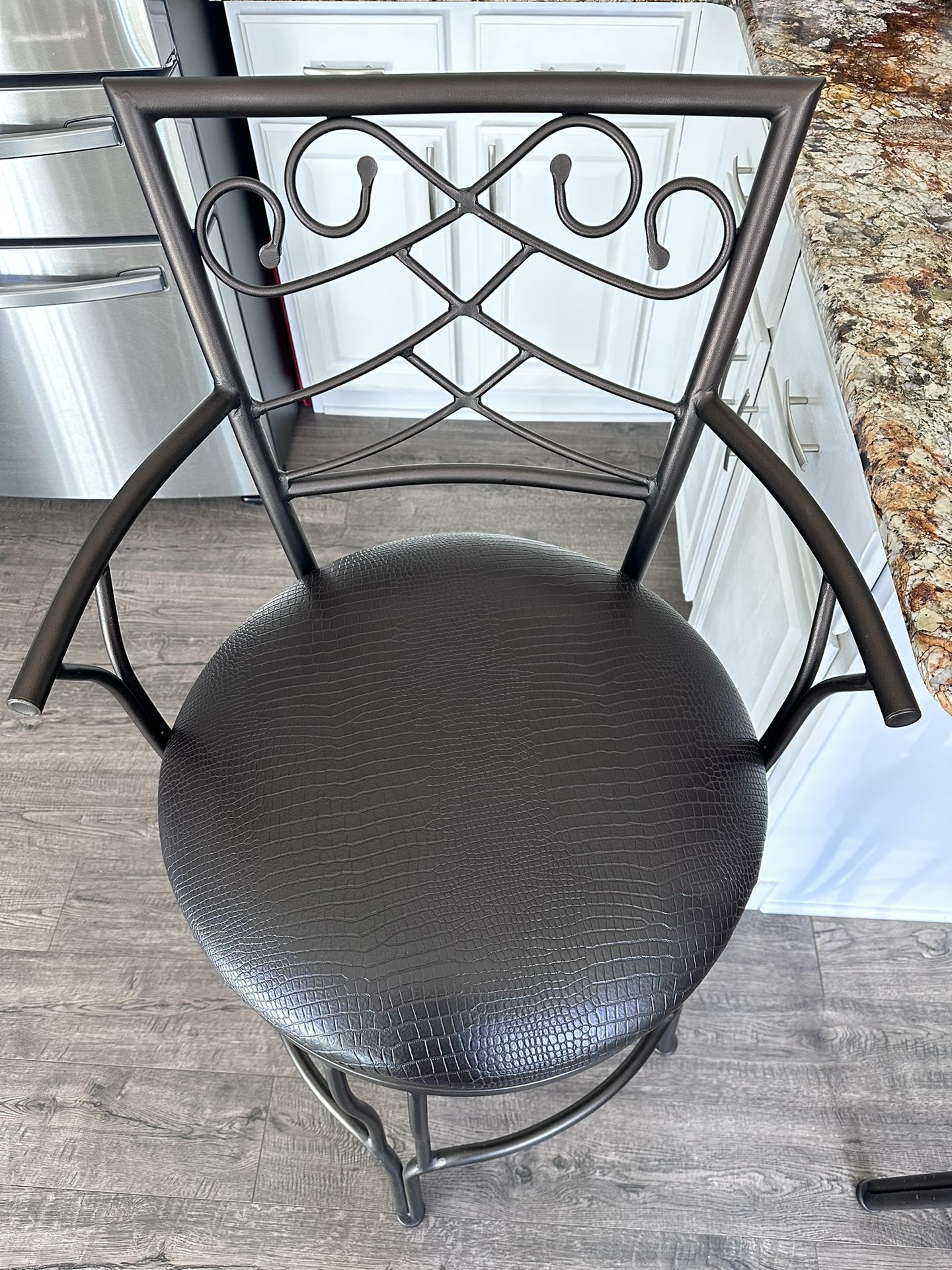 30 Inch Metal Swivel Bar Stool with Armrests and Leatherette Seat, Brown