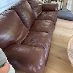 Two Identical Brown Leather Sofas