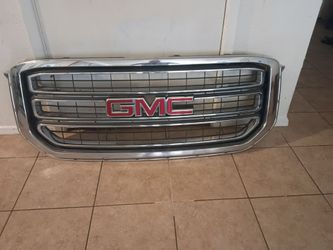 A front grill assembly design for a 2015 through 2020 GMC Yukon and Yukon XL