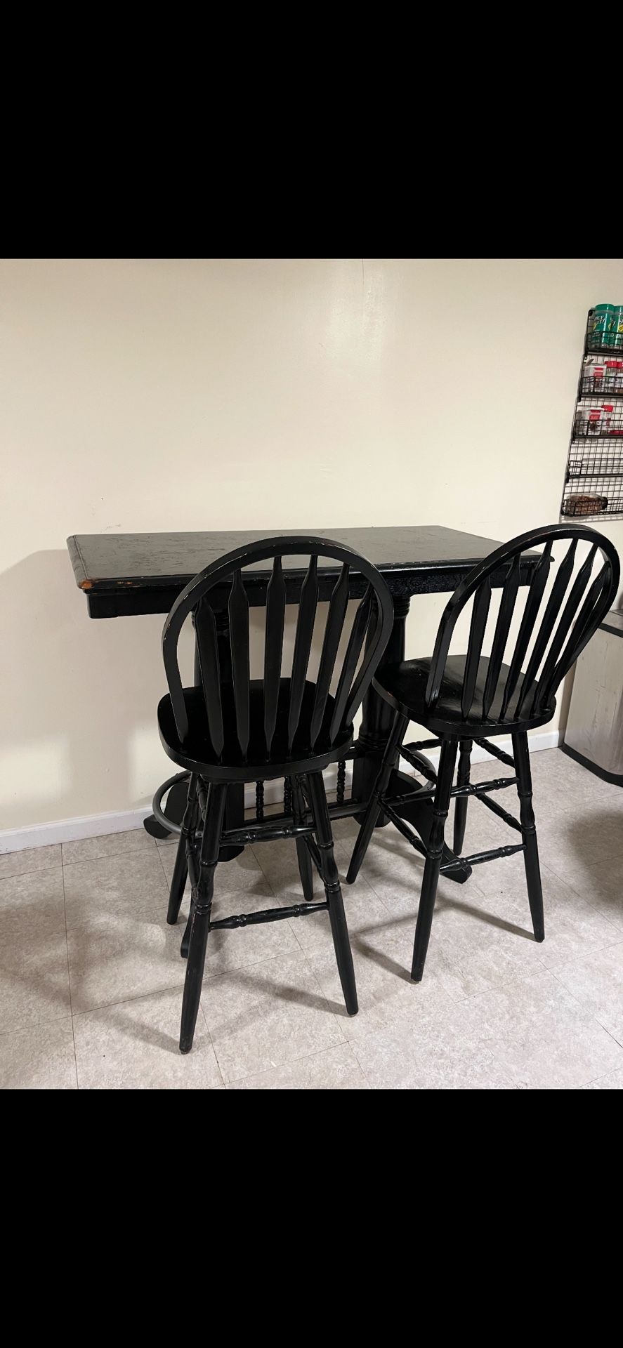 black tall table with 3 chairs