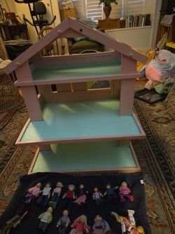 Nice wooden doll house with dolls and furniture32 inches