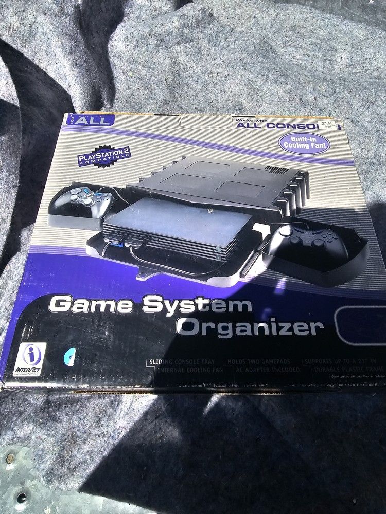 INTERACT ACESSORIES- GAME SYSTEM ORGANIZER- PS2- PLAYSTATION 2 -WITH BOX