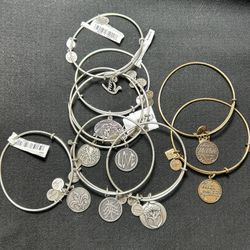 9 Alex And Ani Bracelets. 