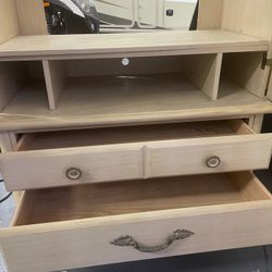 Antique two-door armoire with bifold doors and adjustable shelf. 