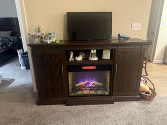 Entertainment console with electric fireplace