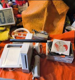 Nintendo, wii bundle with 10 games, drawpad and accessories. Everything works amazing will not separate