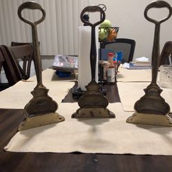 Three Brass Door Stops