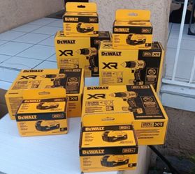 THREE BRAND NEW DEWALT XR BRUSHLESS HAMMER DRILLS AND THREE 20V MAX 4AH BATTERY PACKS
