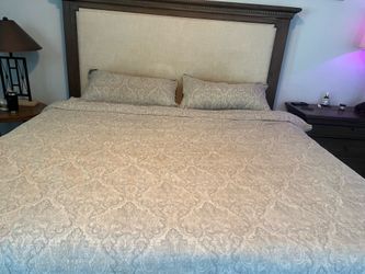 King size bed with upholstered headboard