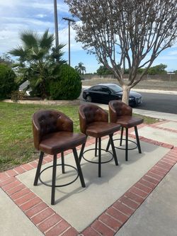 26-inch swivel bar stools with faux-leather cushioning