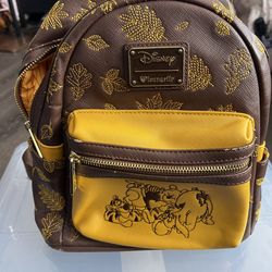 Winnie the Pooh lounge fly backpack