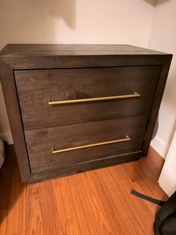 Dark wood queen bed frame, nightstand, and dresser