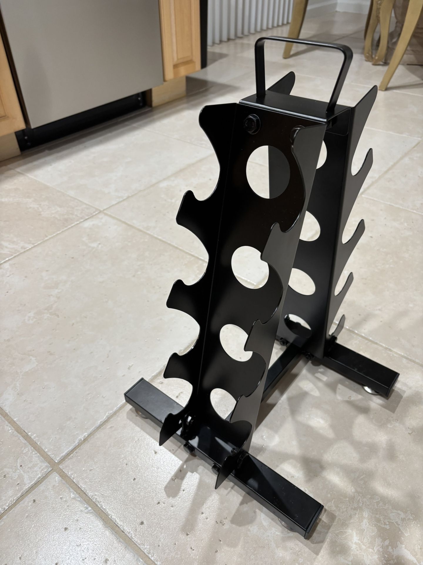New 4 tier dumbbell rack. weight for dumbbell is 5-15 pounds. met a- frame with handle