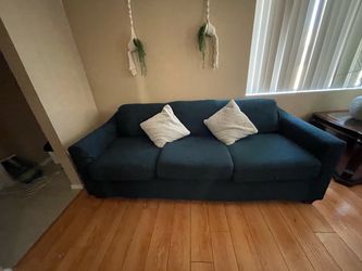 Used couches with covers and pillows