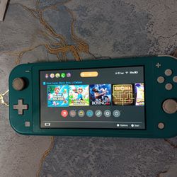 Nintendo Switch  light in good condition  with  charger has mario ganes in the system 